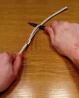 OneCup OneLife - Cutting the plastic around the wires with a knife 2.jpg